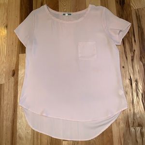 Francesca’s pink shirt